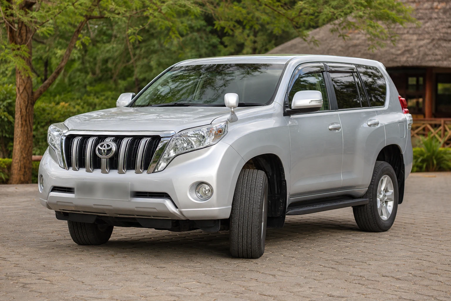 Silver Toyota Land Cruiser Prado in a professional outdoor product photograph